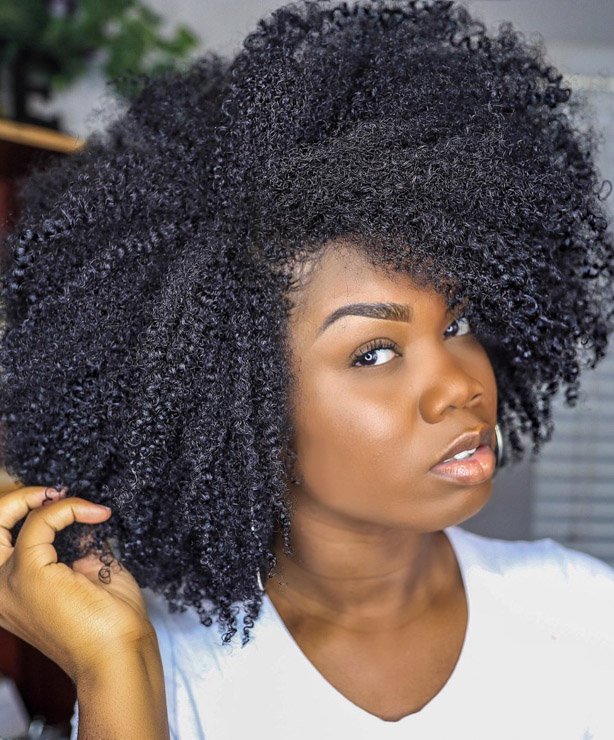 Afro hairstyle with side parting
