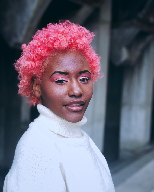 Coral pink afro curls vibrant color
