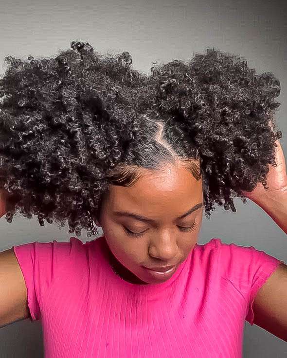 Double puff hairstyle with defined curls