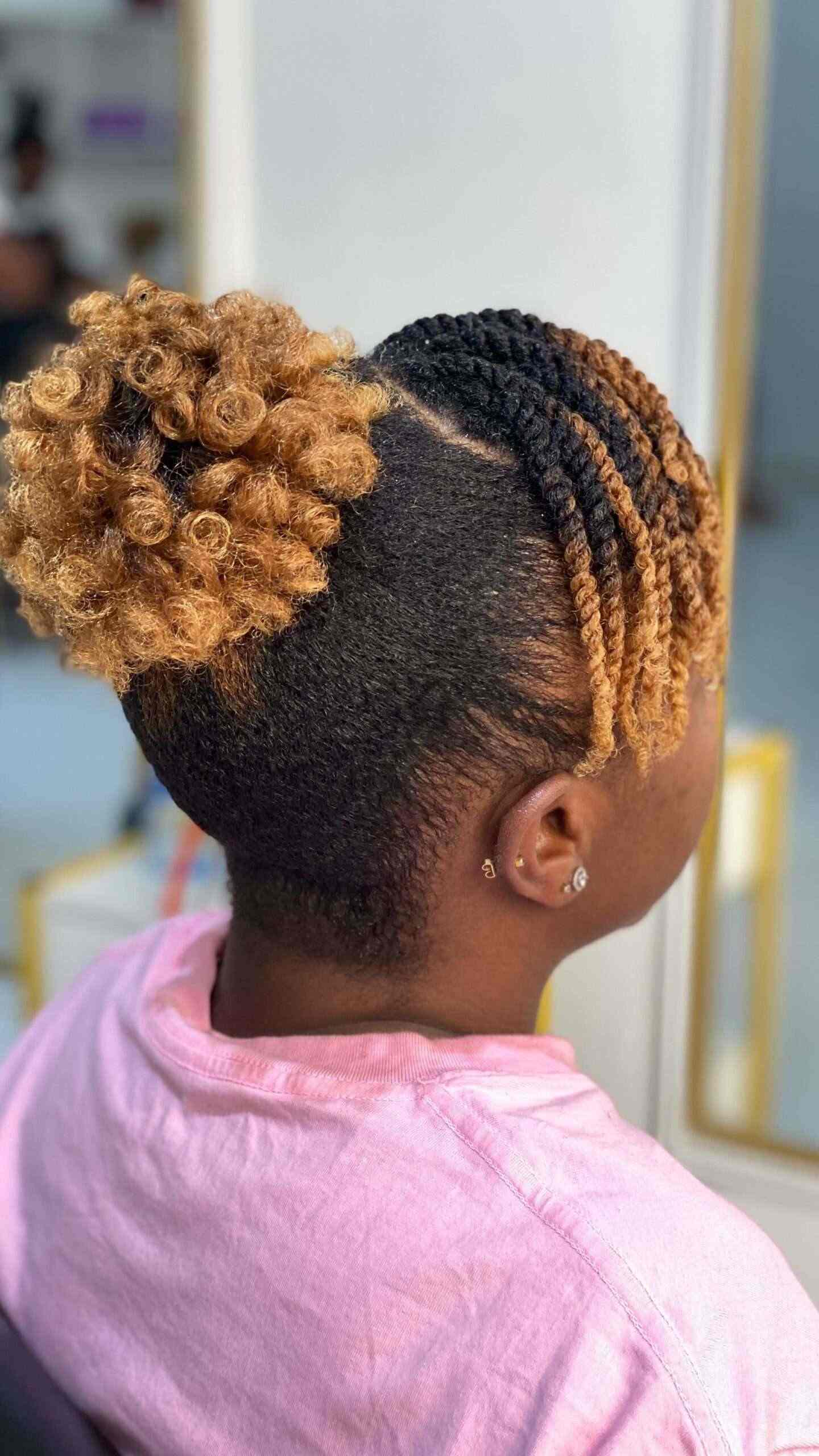 Curly top knot with undercut style