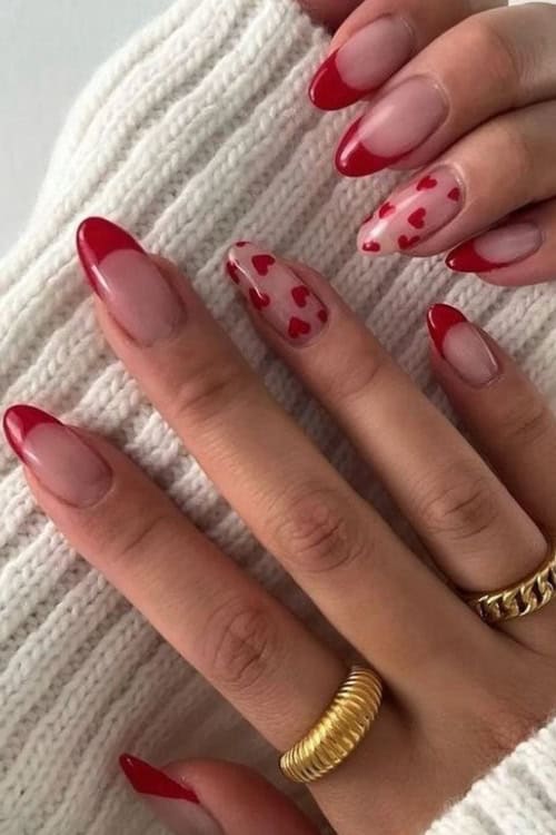 Red heart accents on neutral nails