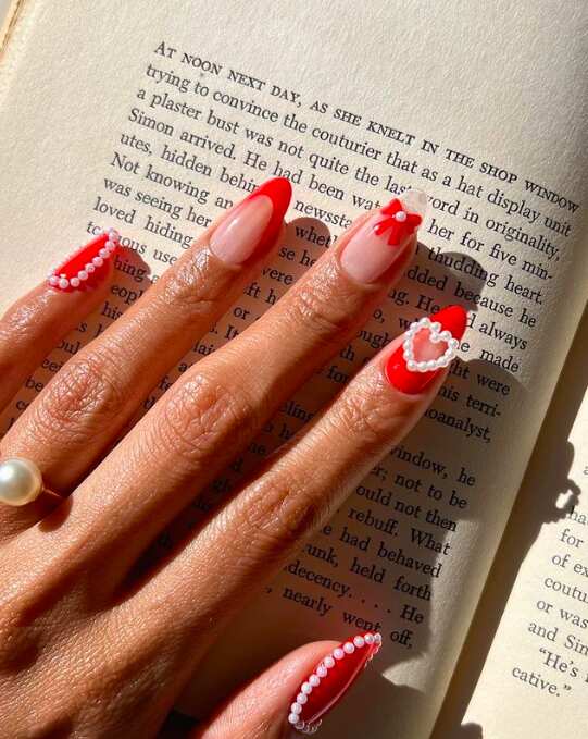 Red nails with pearls and heart details