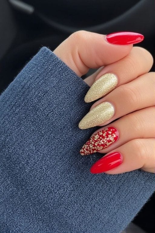 Red nails with gold glitter accents