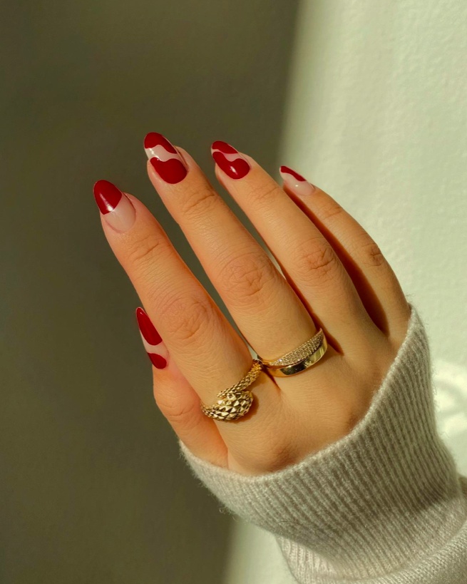 Red heart accents on nude nails