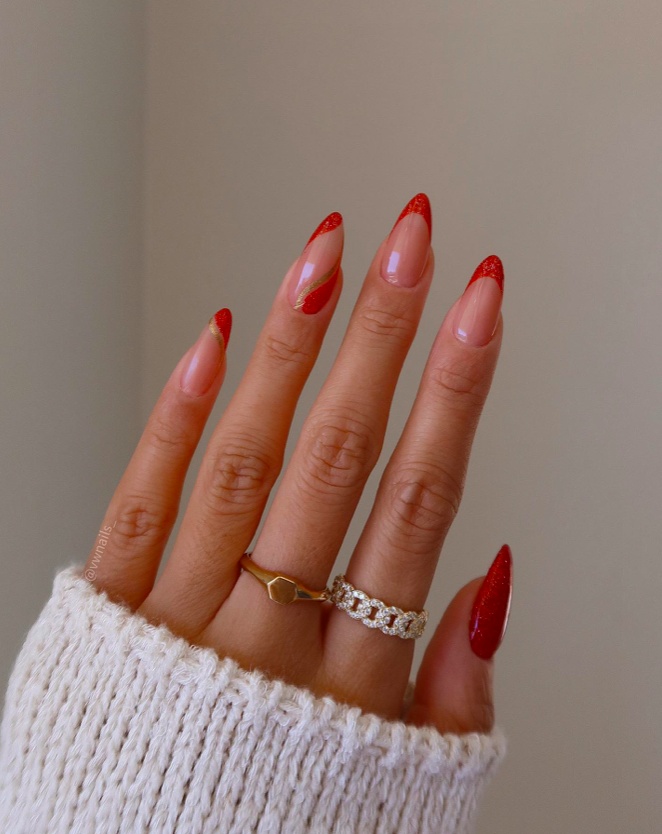 Subtle red glitter accents on nude nails