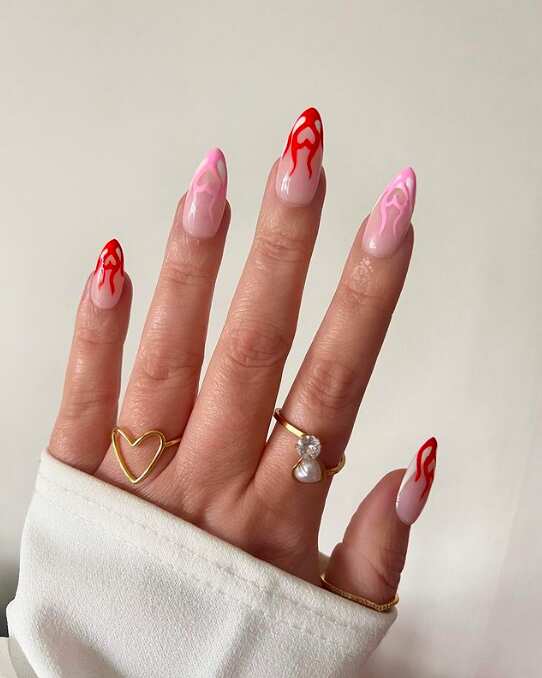 Red flame tips on pink nails