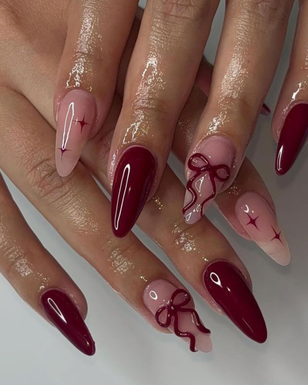 Elegant red nails with bow accents