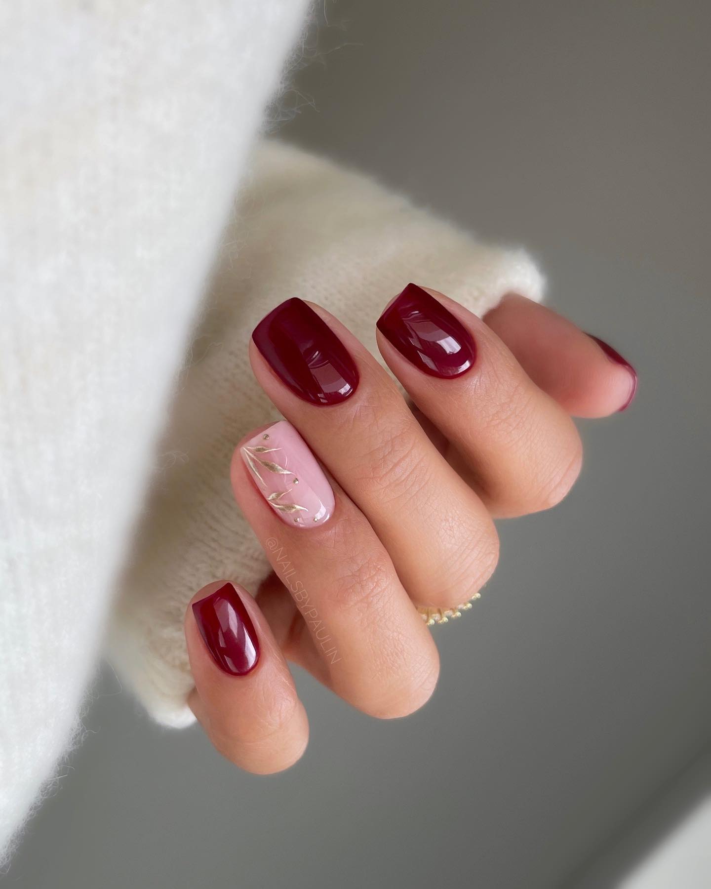 Deep red nails with accent nail