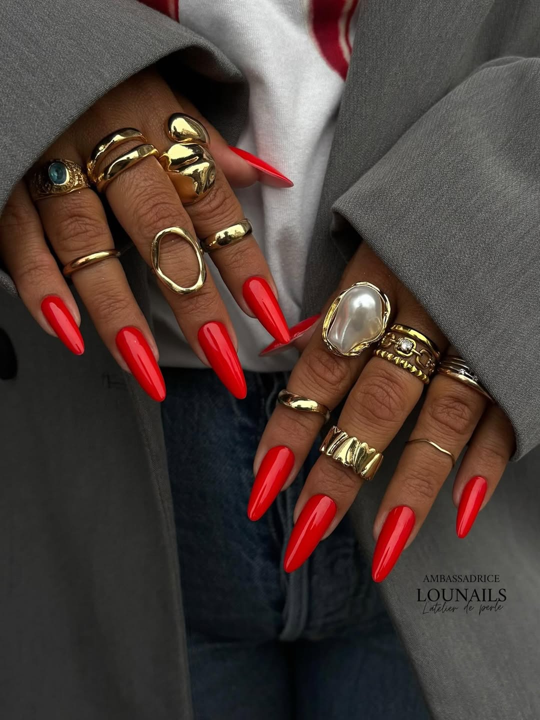 Bold red stiletto nails with rings
