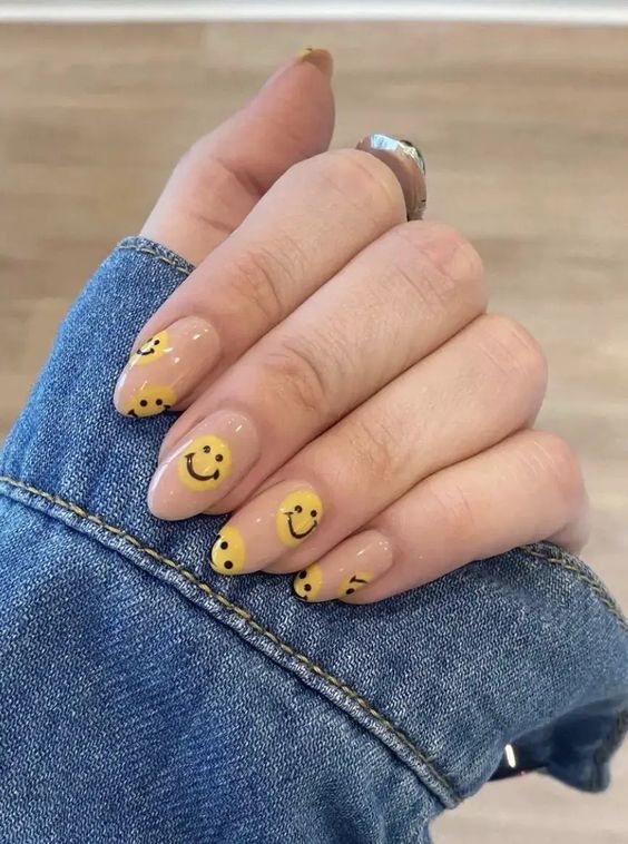 Almond nails with yellow smiley face design