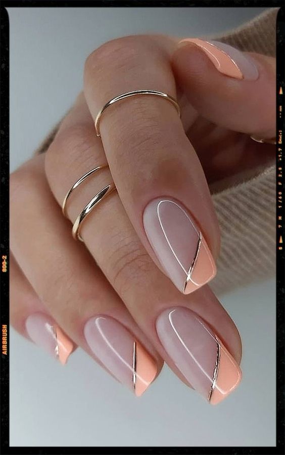 Peach almond nails with gold line accent