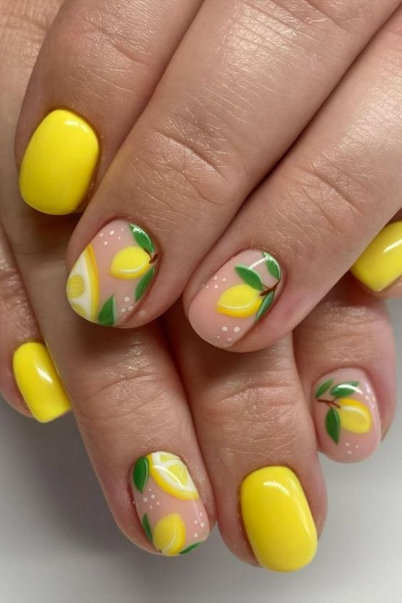 Yellow nails with lemon and leaf art