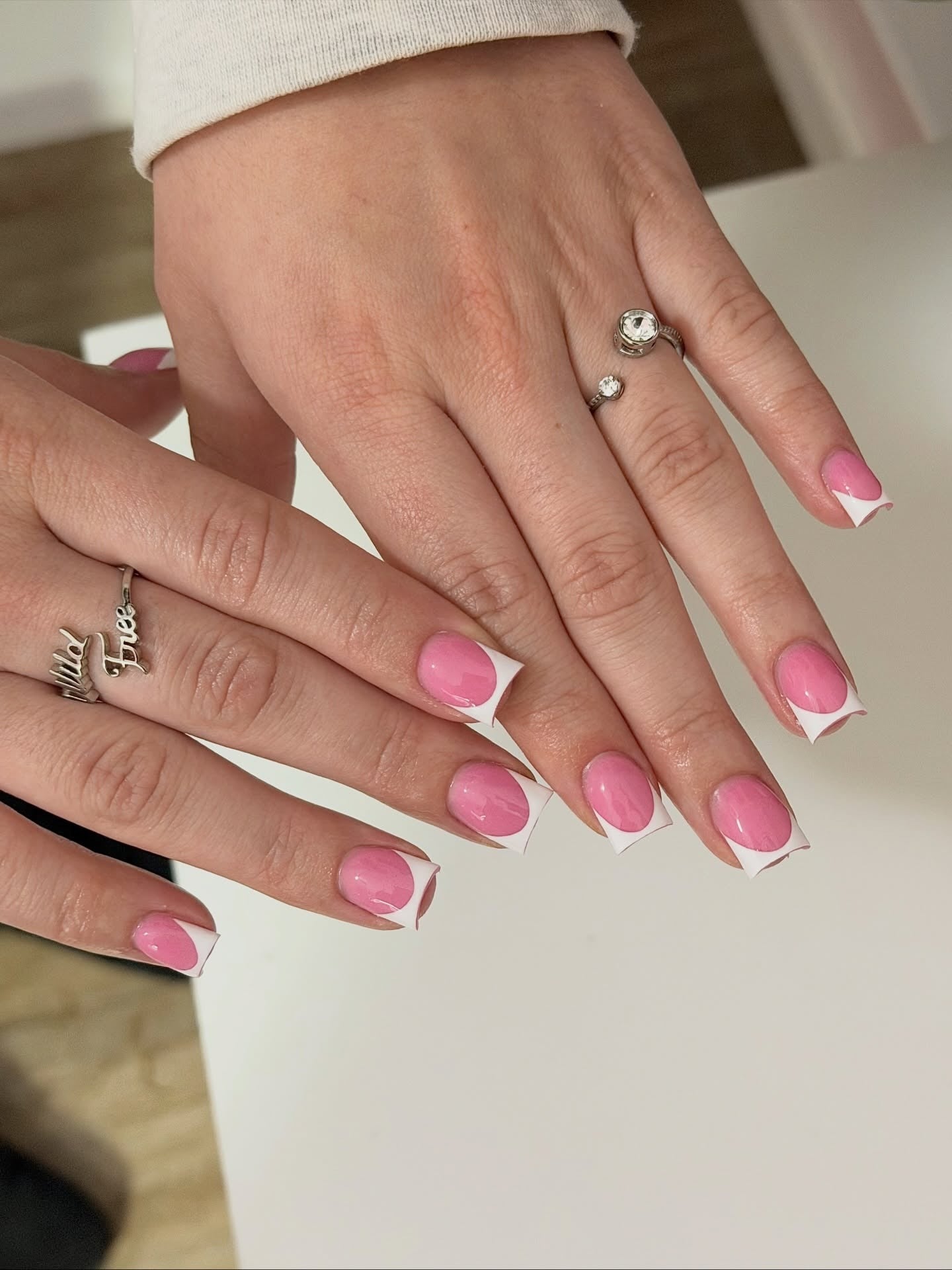 Pink nails with white geometric tips