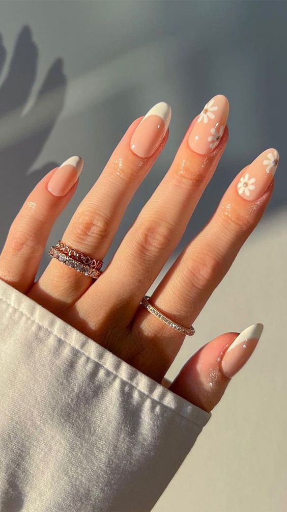 Nude nails with white floral French tips