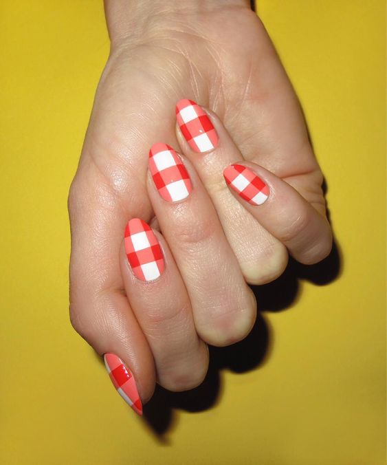Almond nails with red and white gingham pattern