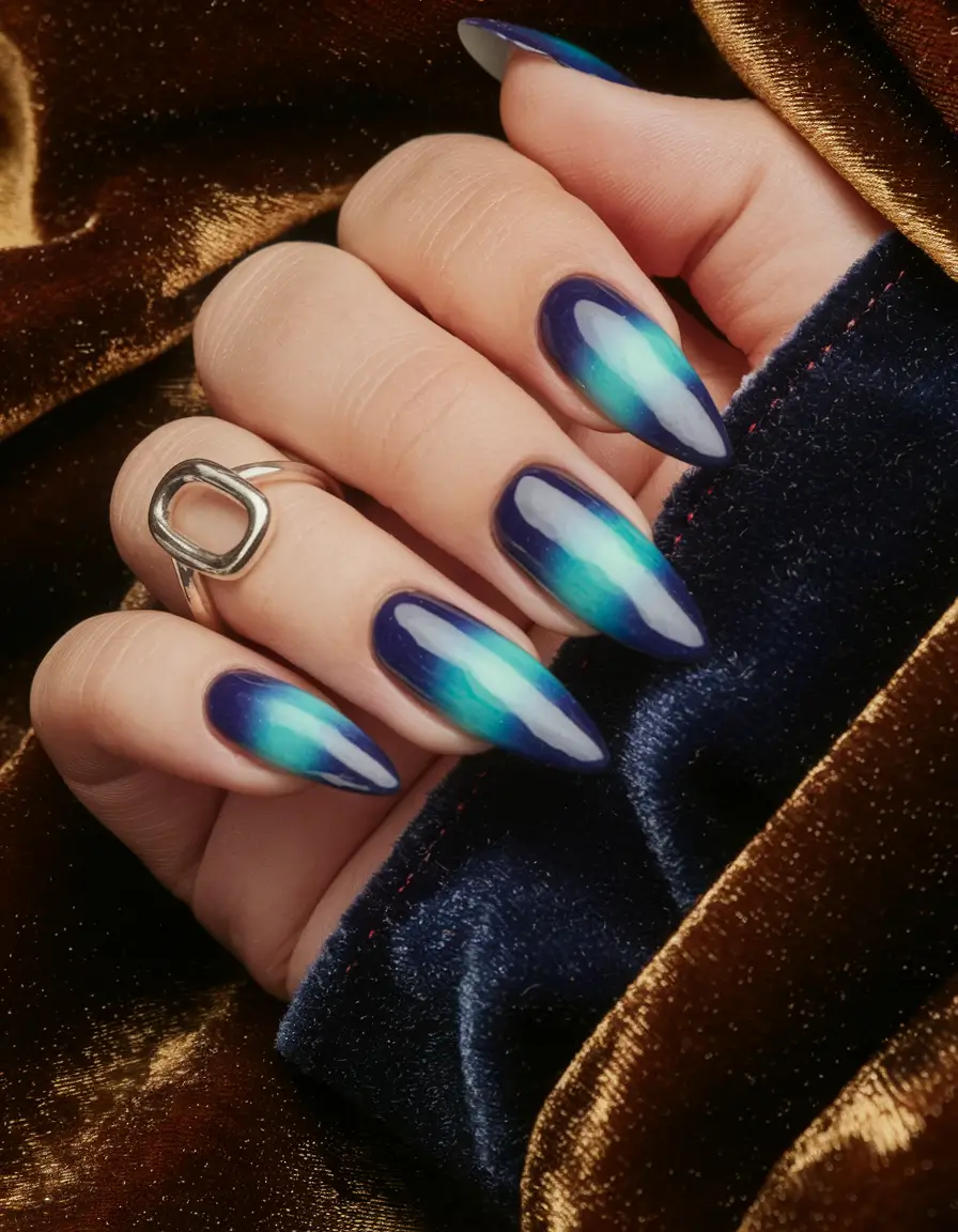 Medium almond nails with blue ombre effect