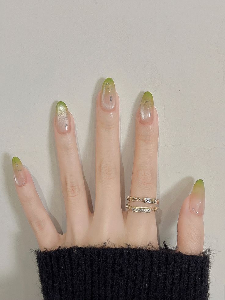 Green gradient nails with a glossy, elegant finish, perfect for modern Pinterest aesthetics.