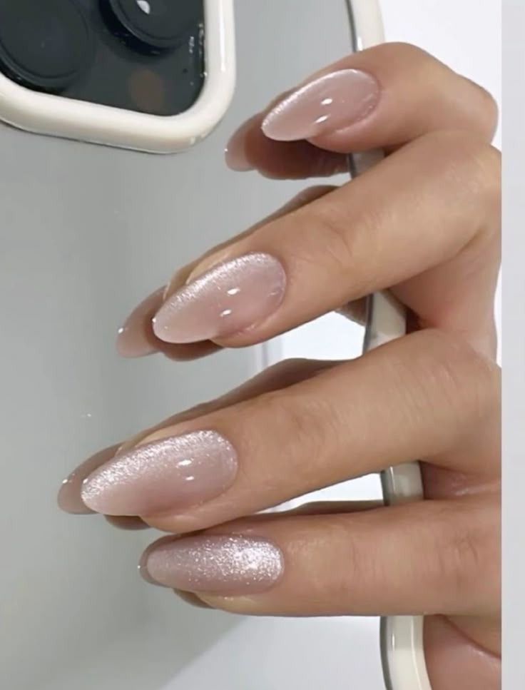 Pearl shimmer nails, soft and graceful.