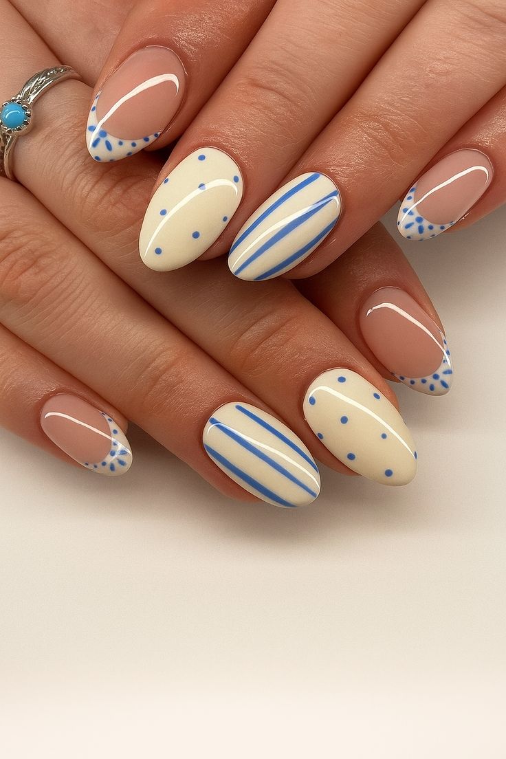 Graphic blue and white nails, bold and creative.