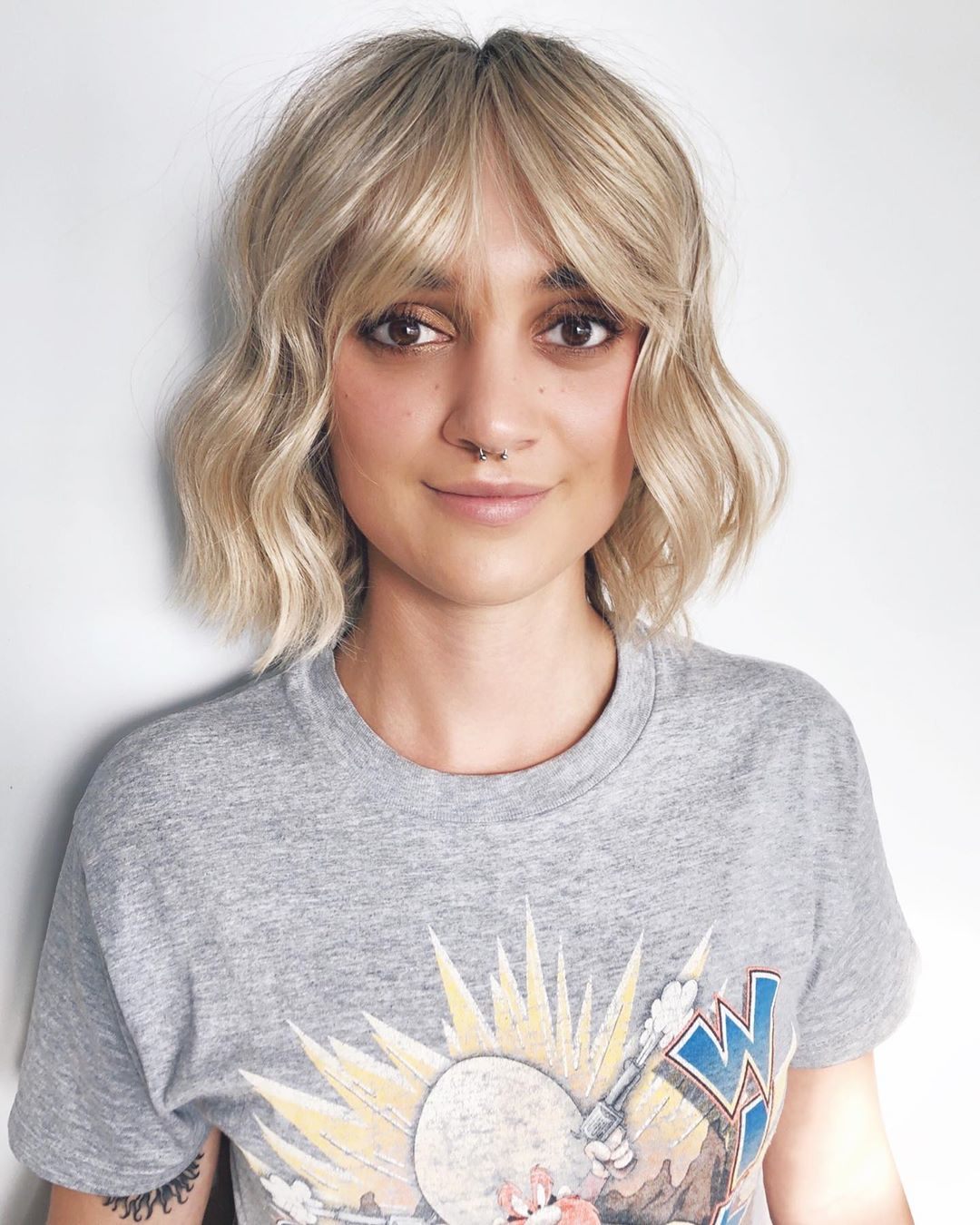 Textured blonde bob with curtain bangs