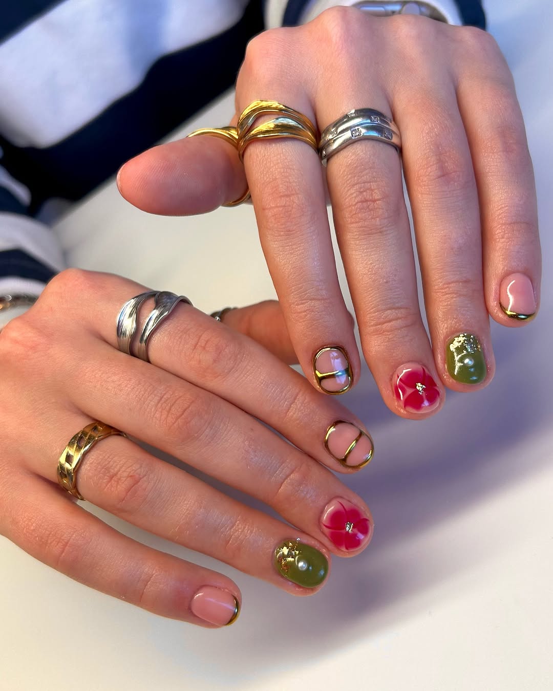 Artistic short gel nails with geometric accents and vibrant colors