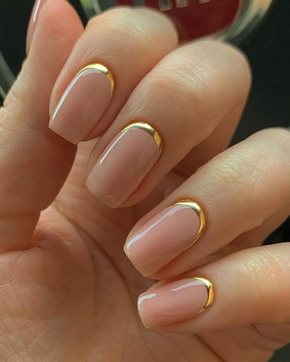 Short gel nails with golden cuticle accents