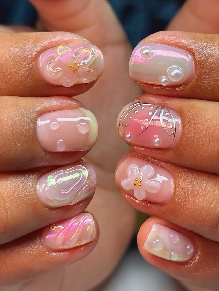 Short gel nails with intricate floral and butterfly designs