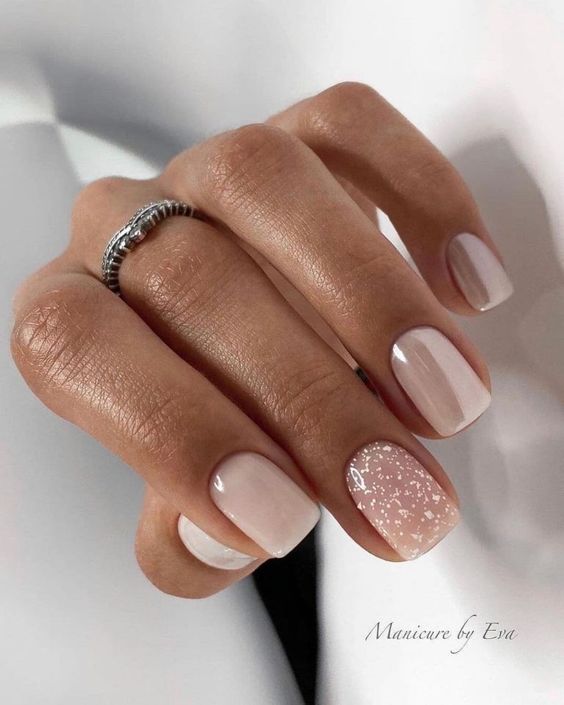 Short pastel pink gel nails with glitter accent nail