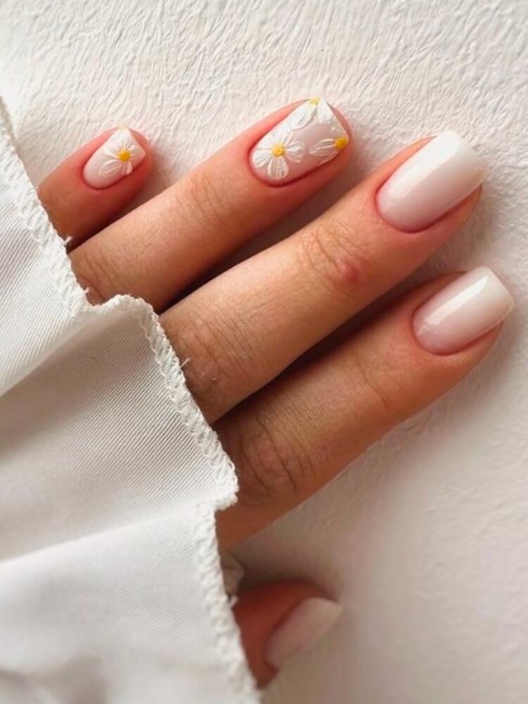 Short square gel nails with daisy art on soft pink