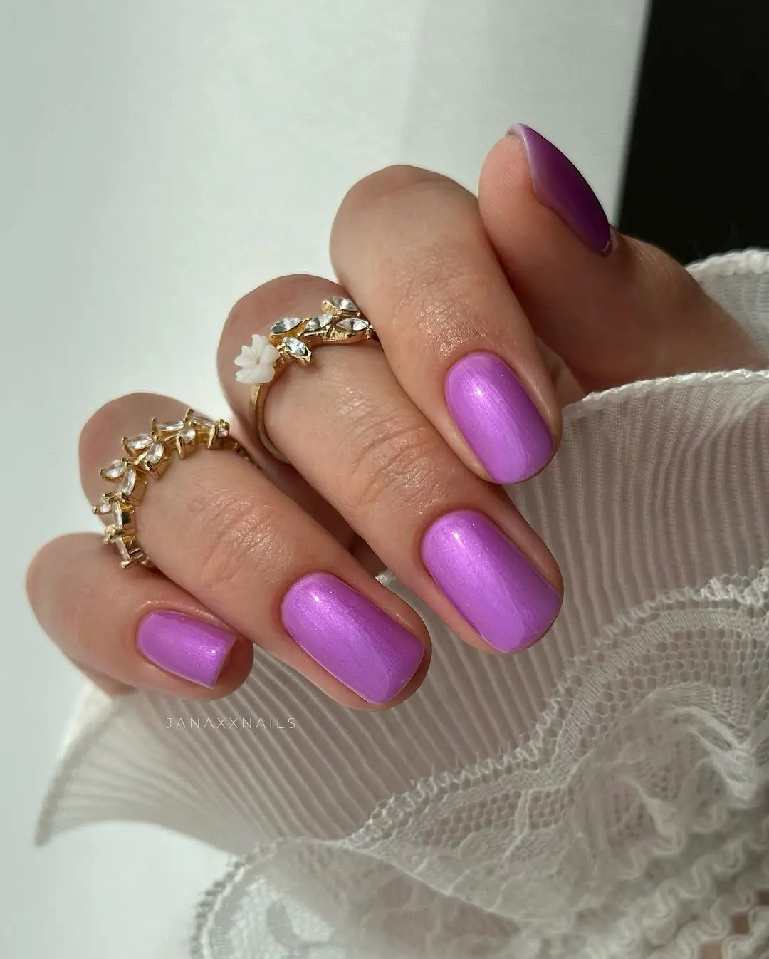 Short square nails with vibrant violet shimmer, Pinterest nail inspiration.