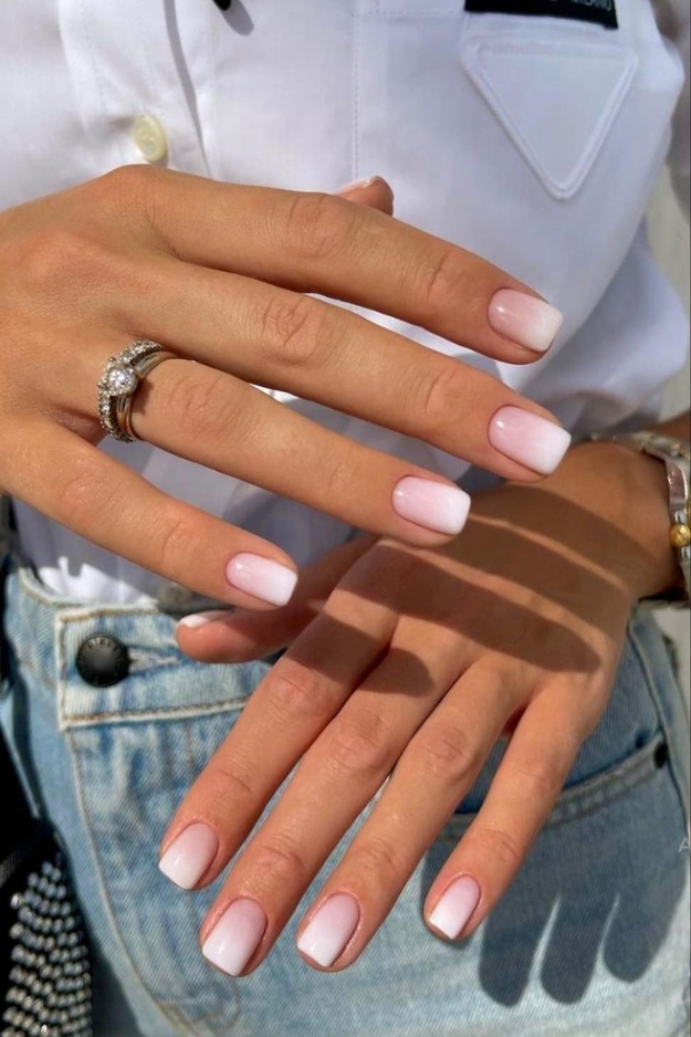 Short square nails with classic French ombré, timeless nail style.