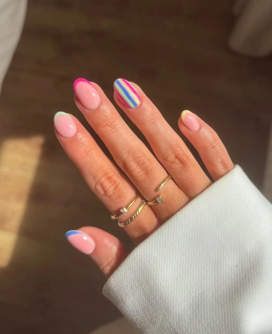 Short square nails with colorful stripes, vibrant and playful.