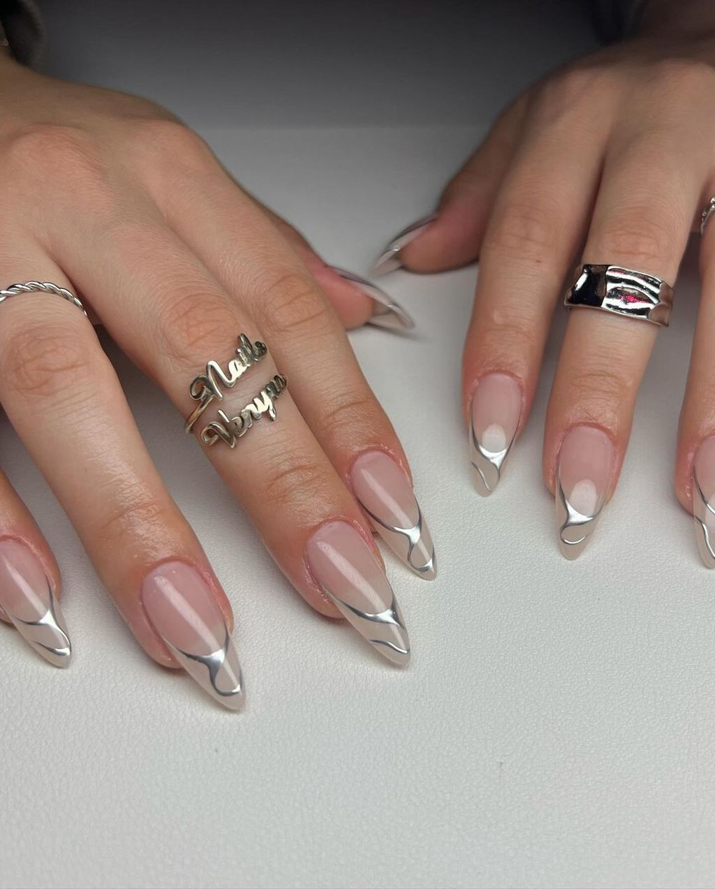 Nail art with silver French tips, stylish and modern design
