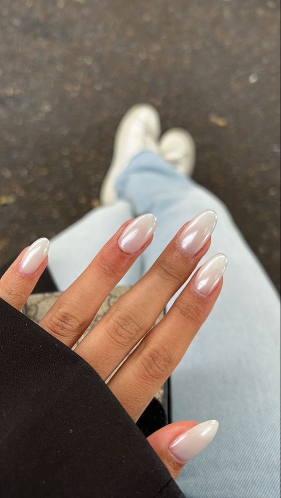 Almond nails with pearlescent silver finish, elegant nail trend