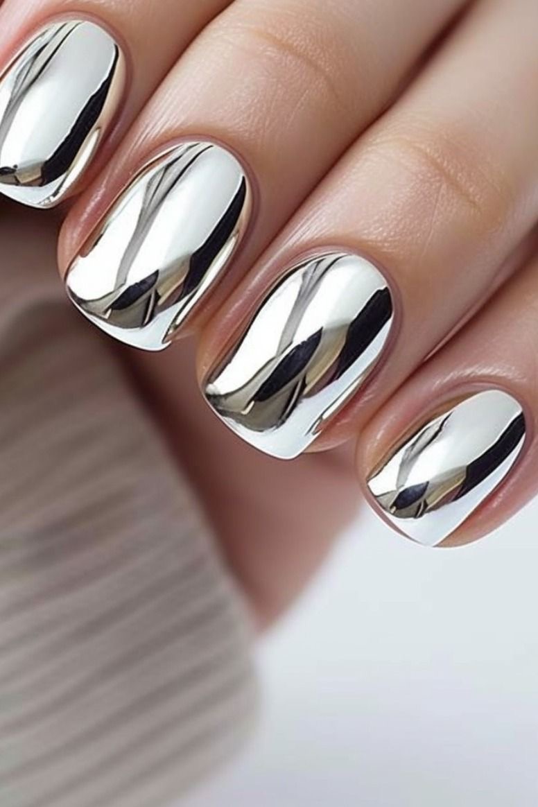 Short square nails with mirror chrome finish, bold statement manicure