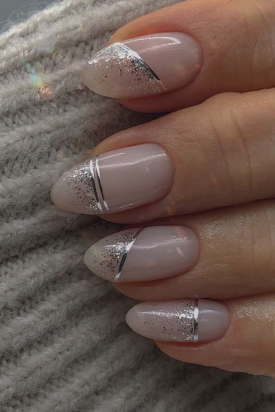 Almond nails with glitter and silver lines, elegant nail art