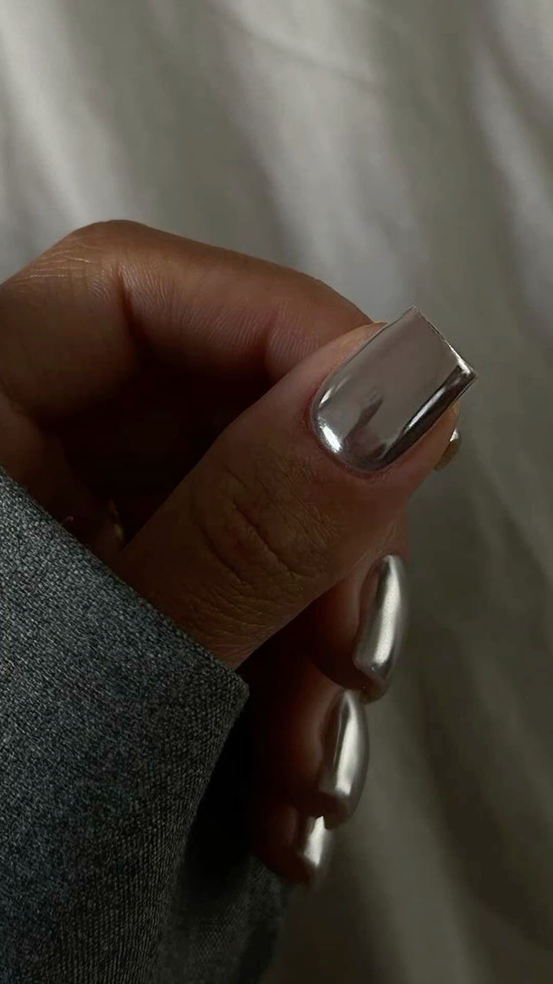 Short square nails with pure silver finish, timeless manicure