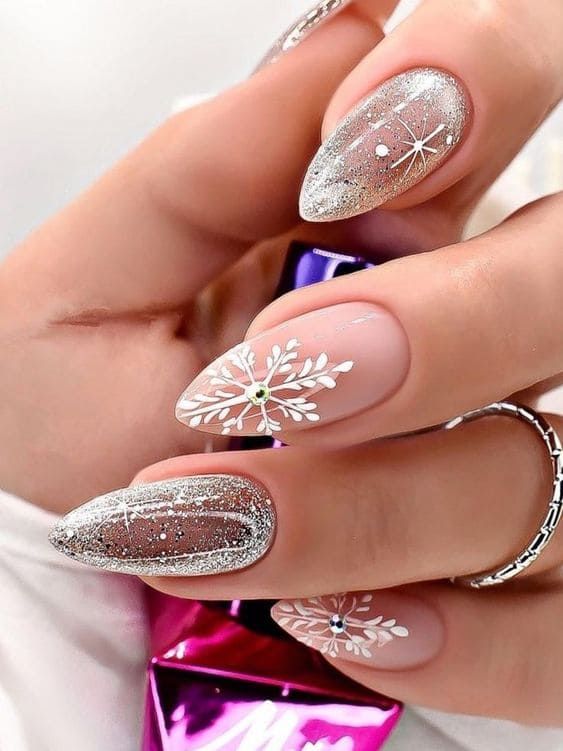 Stiletto nails with silver snowflakes, festive nail art