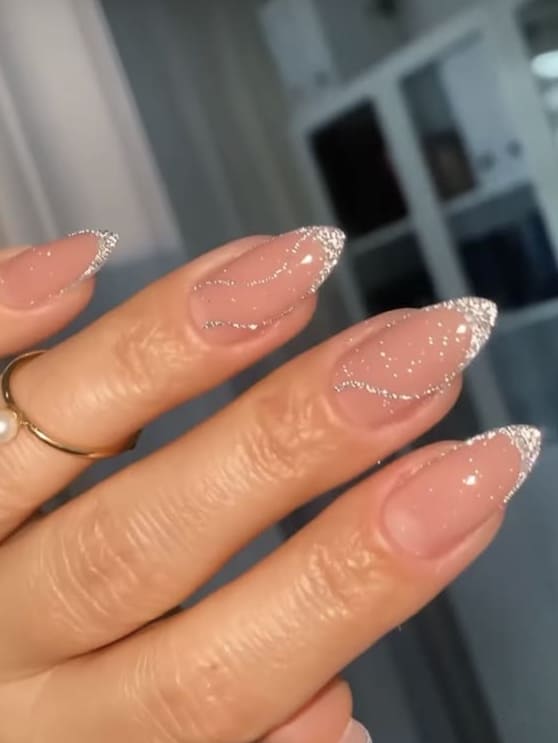 Almond nails with silver wave tips, elegant nail art