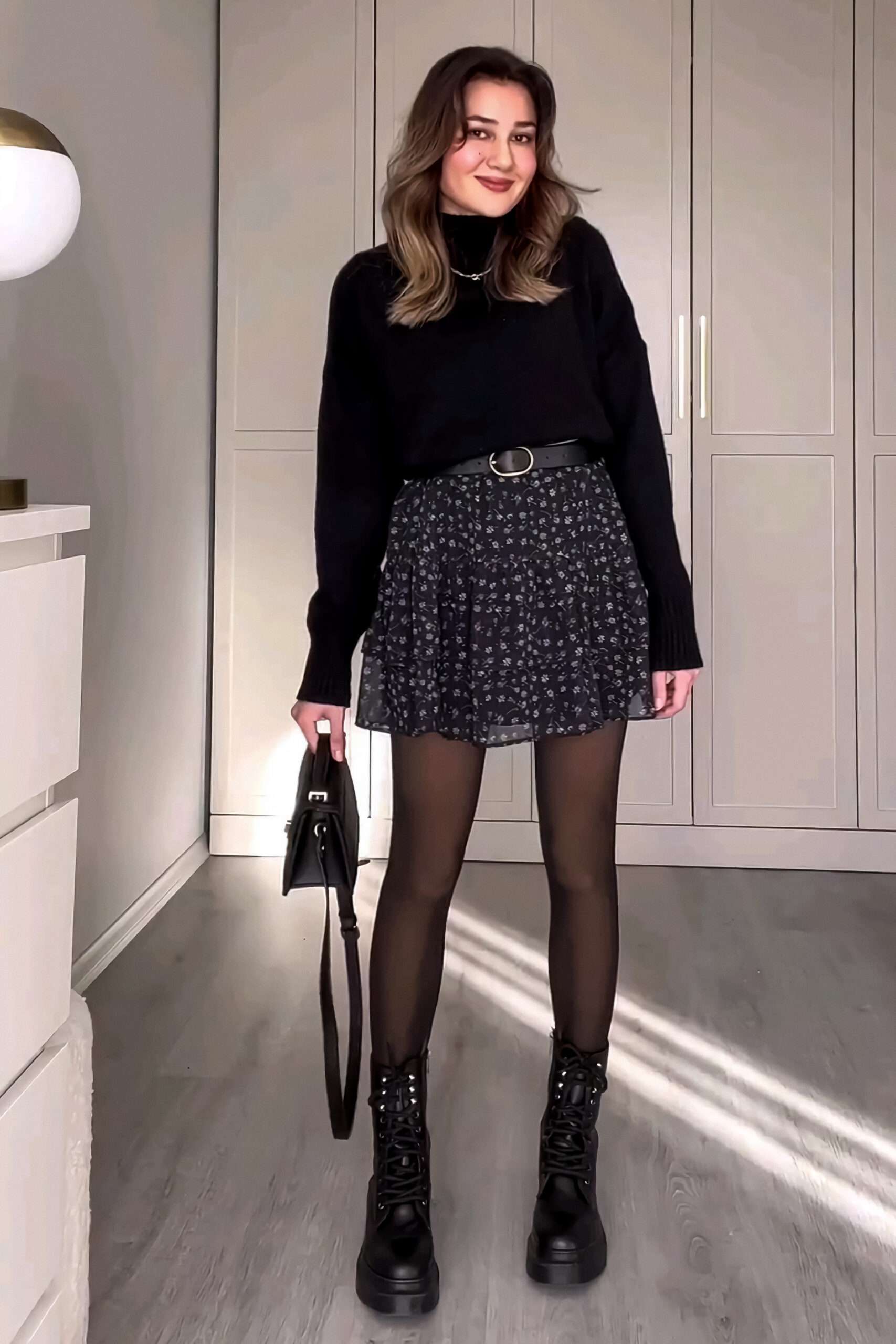 Black mini skirt with sweater and tights