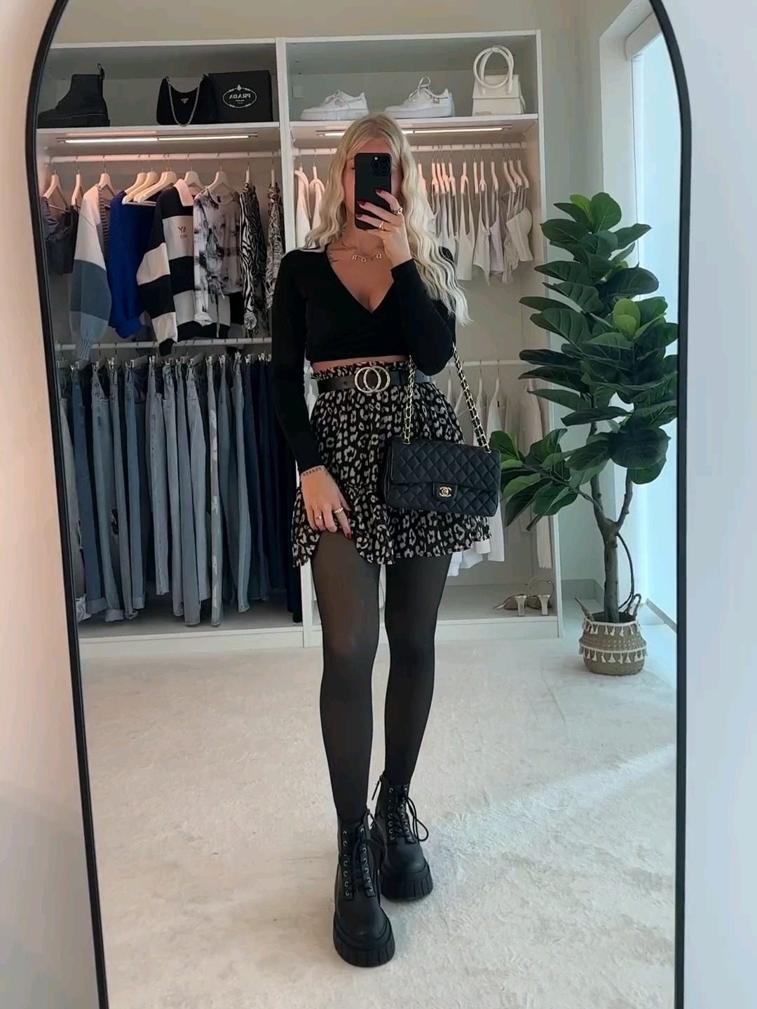 Leopard mini skirt with black top and boots