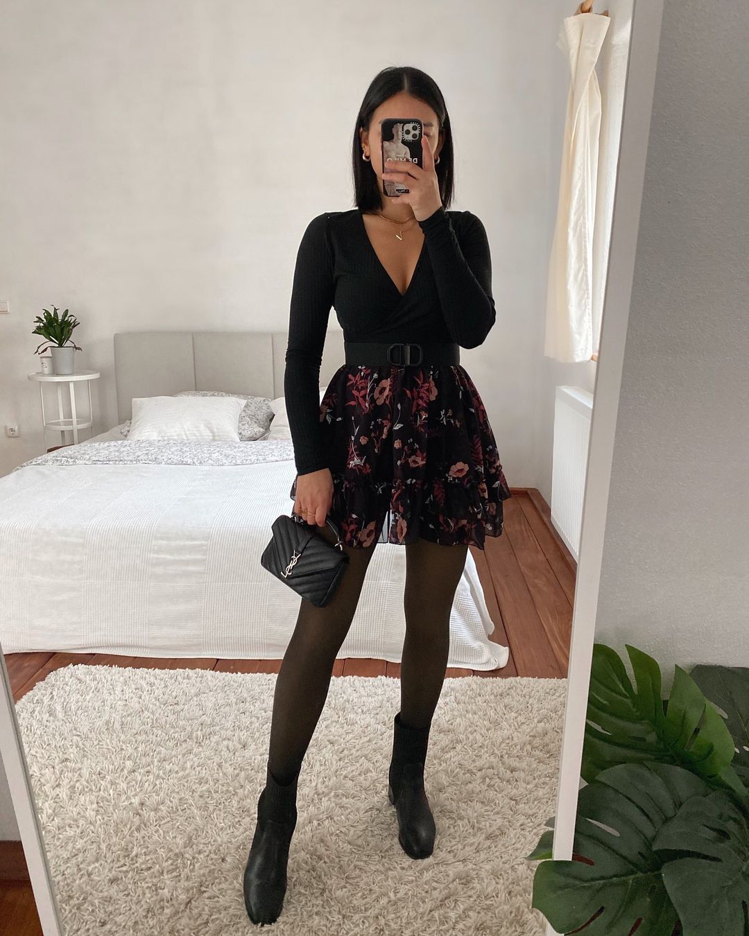 Black floral mini skirt with fitted top and boots