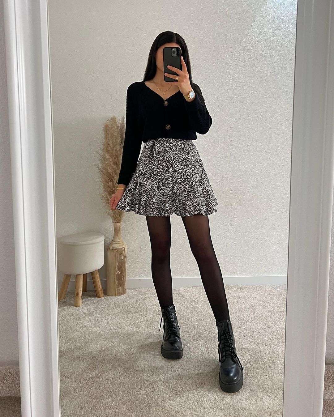 Black sweater with flared skirt and boots