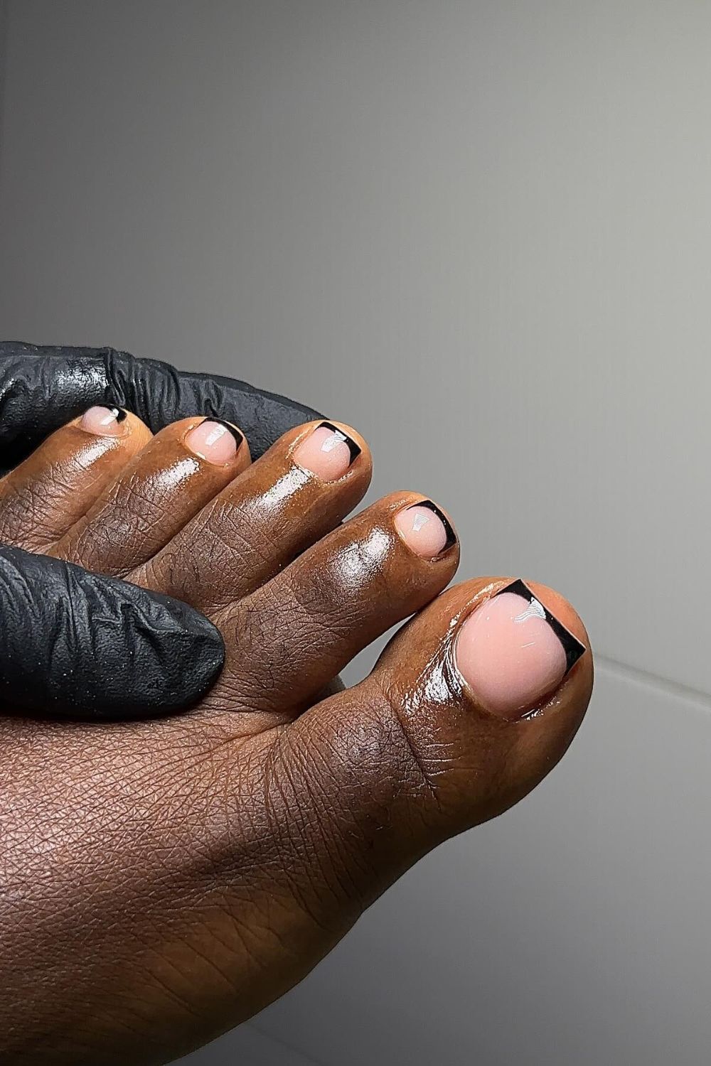 Nude toe nails with black French tips