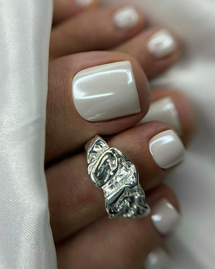 Pearl white toe nails with a luxurious finish