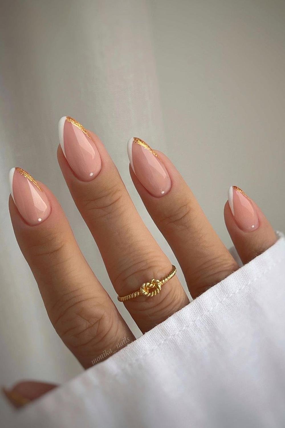 French manicure with gold leaf, almond shape