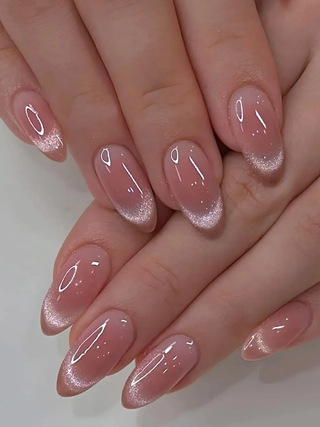 Blush nails with shimmer, French fade, almond shape