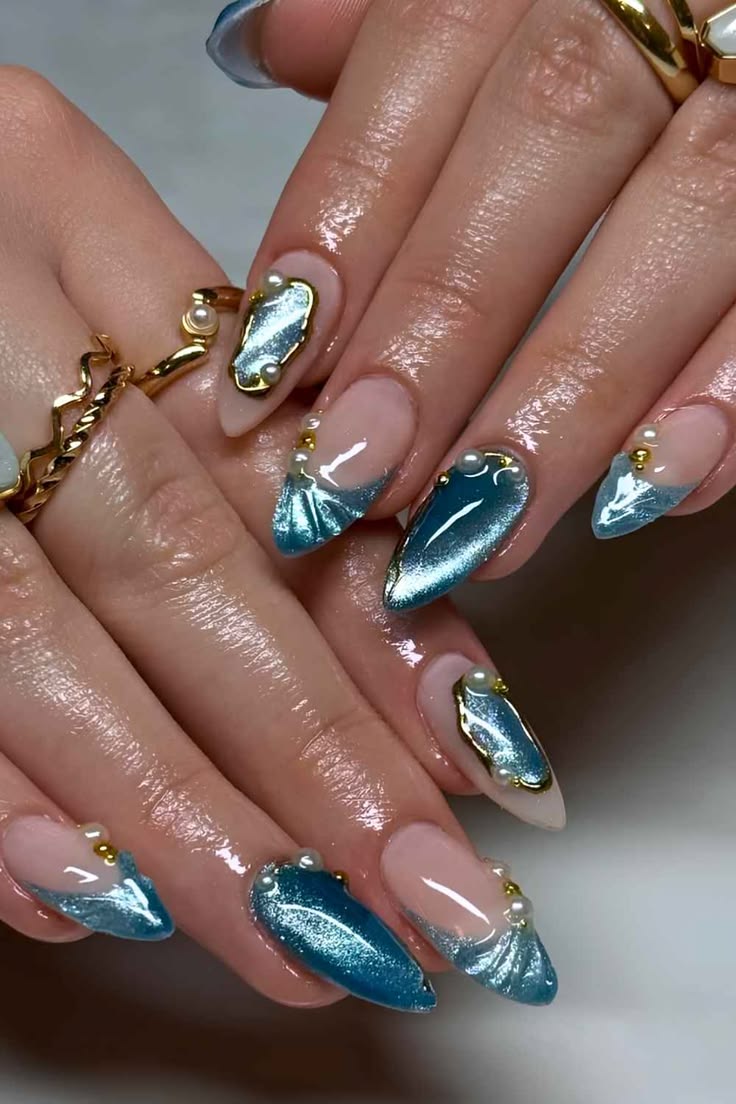 Blue nails with gold, stiletto shape, oceanic theme