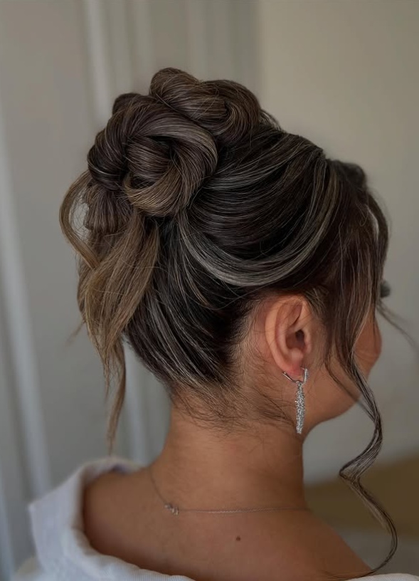 Chic high bow bun with sleek finish