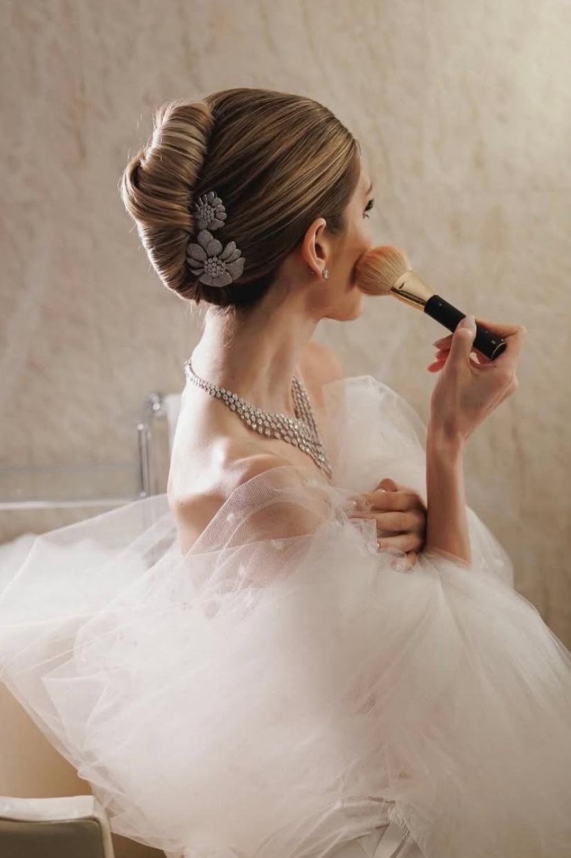Glamorous French roll with floral pins
